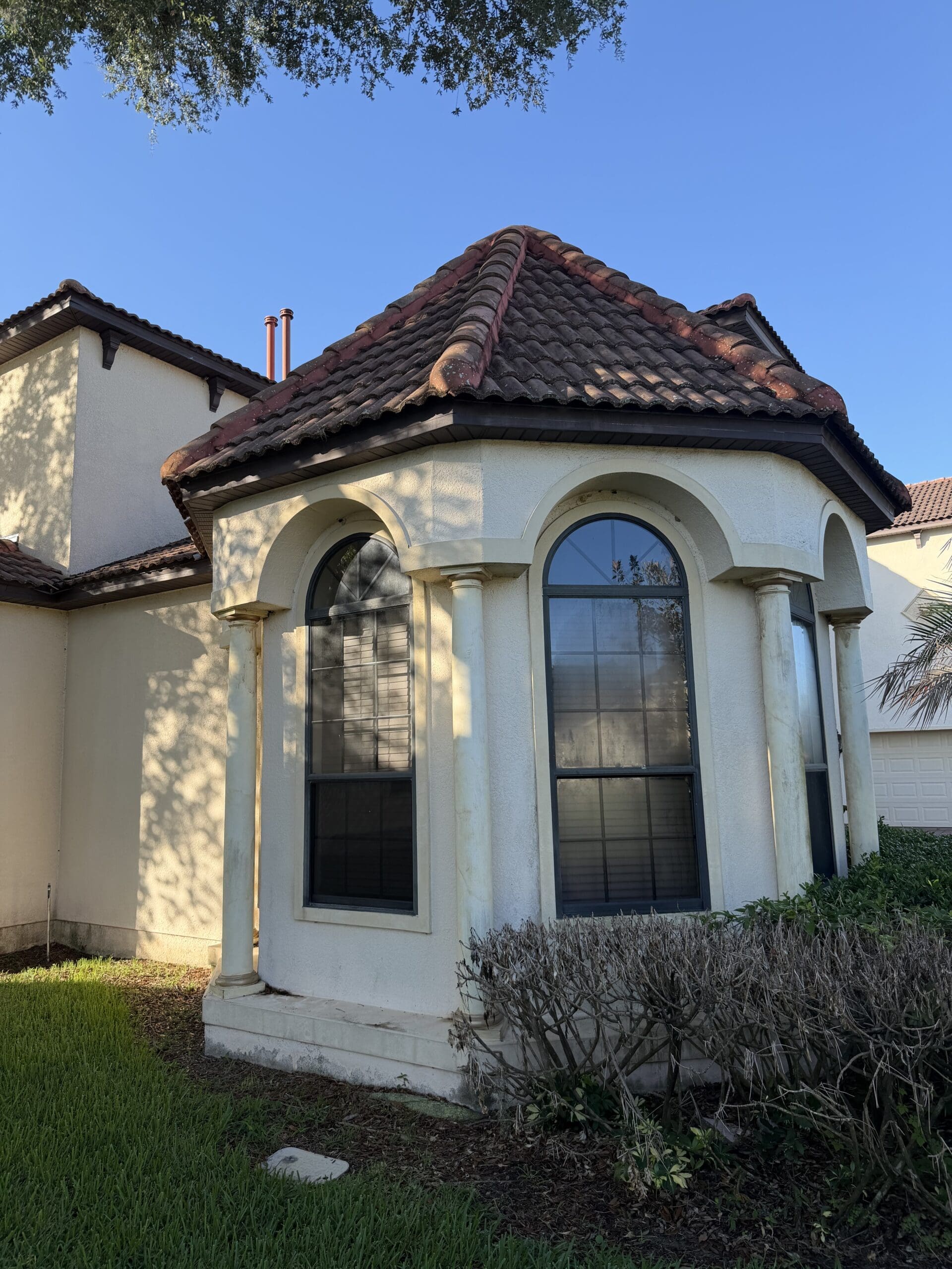 Before — Stucco columns and arched windows in Orlando, FL